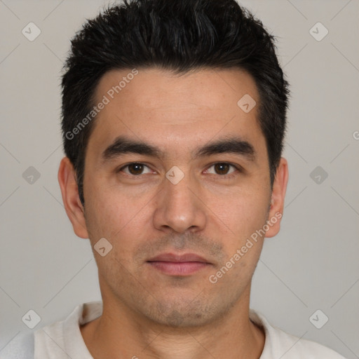 Joyful white young-adult male with short  black hair and brown eyes