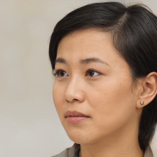 Neutral asian young-adult female with medium  black hair and brown eyes