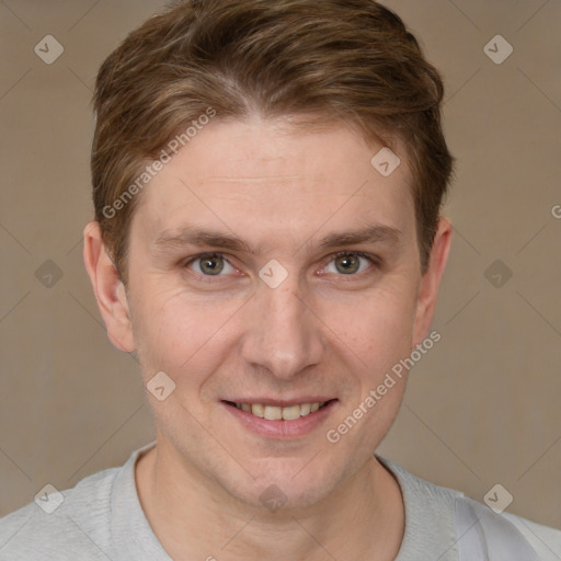 Joyful white adult male with short  brown hair and grey eyes