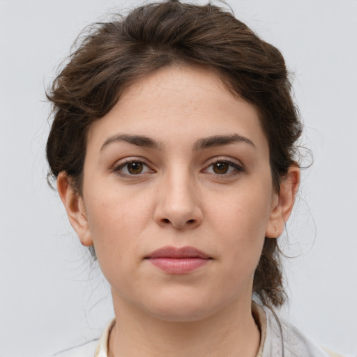 Neutral white young-adult female with medium  brown hair and brown eyes