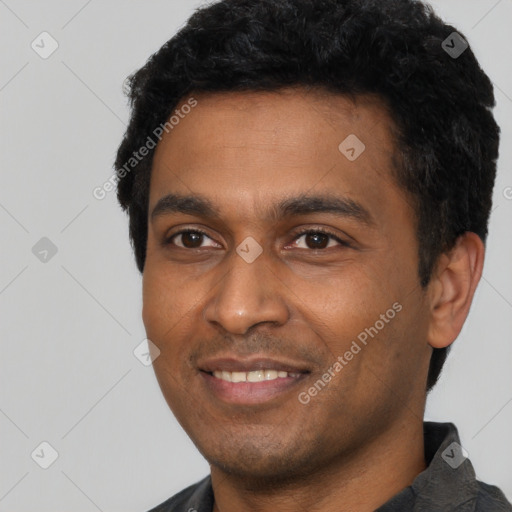 Joyful latino young-adult male with short  black hair and brown eyes