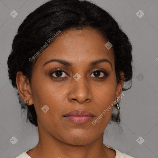 Joyful black young-adult female with medium  brown hair and brown eyes