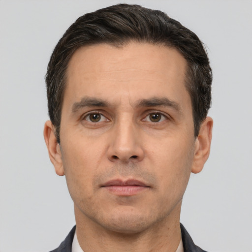 Neutral white adult male with short  black hair and brown eyes