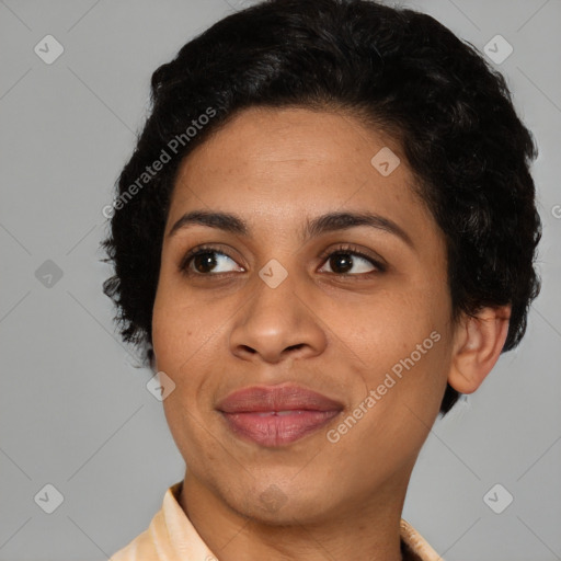 Joyful black young-adult female with short  black hair and brown eyes