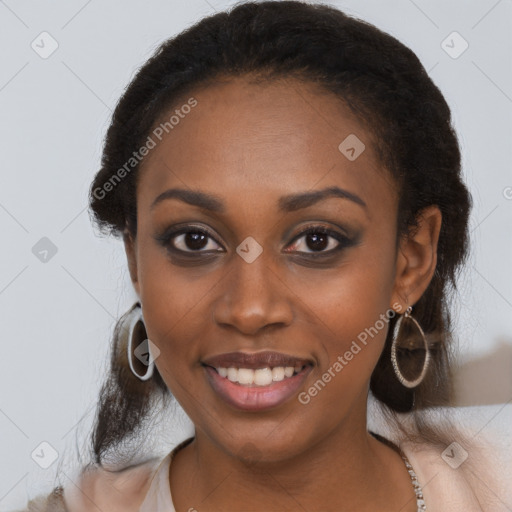 Joyful black young-adult female with long  brown hair and brown eyes