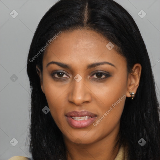 Joyful black young-adult female with long  black hair and brown eyes