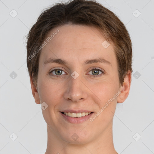 Joyful white young-adult female with short  brown hair and grey eyes