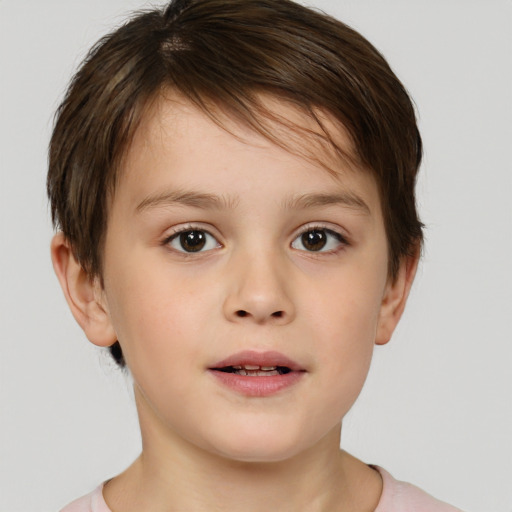 Joyful white child male with short  brown hair and brown eyes