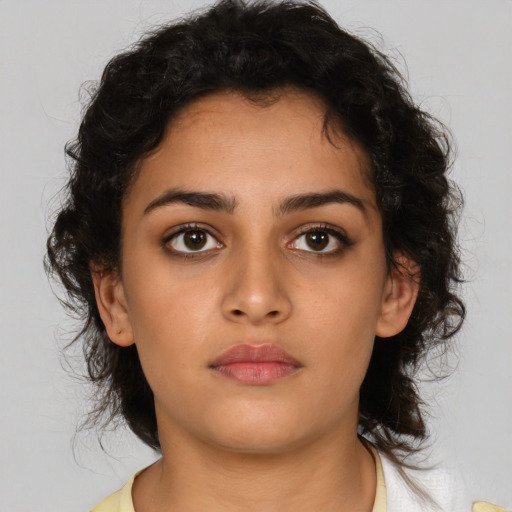 Neutral latino young-adult female with medium  brown hair and brown eyes