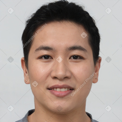 Joyful asian young-adult male with short  brown hair and brown eyes