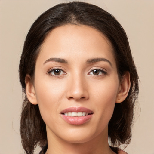 Joyful white young-adult female with medium  brown hair and brown eyes