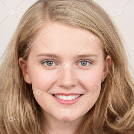 Joyful white young-adult female with long  brown hair and blue eyes