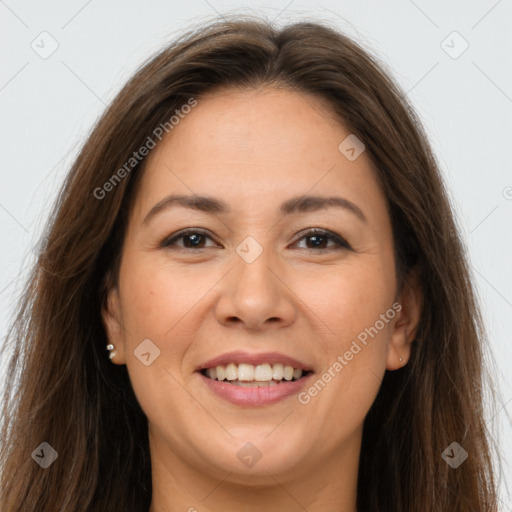 Joyful white adult female with long  brown hair and brown eyes