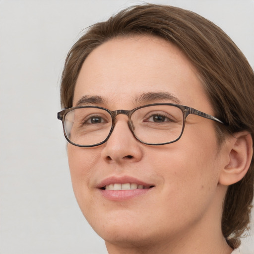 Joyful white young-adult female with medium  brown hair and blue eyes