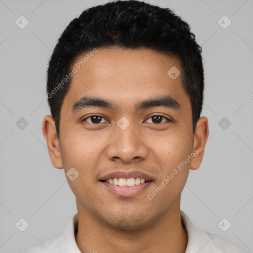 Joyful latino young-adult male with short  black hair and brown eyes