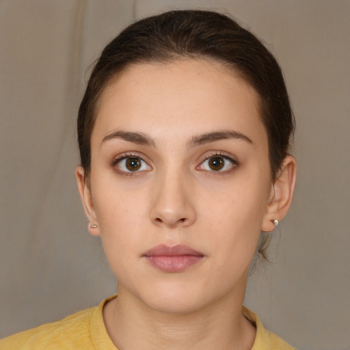 Neutral white young-adult female with short  brown hair and brown eyes