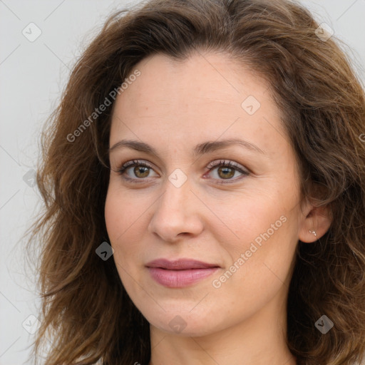 Joyful white adult female with long  brown hair and brown eyes