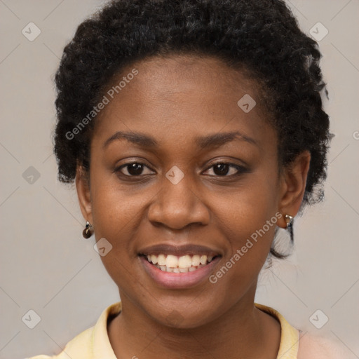 Joyful black young-adult female with short  brown hair and brown eyes