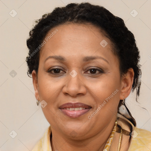 Joyful black adult female with short  brown hair and brown eyes