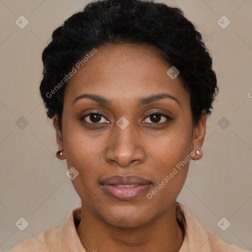 Joyful black young-adult female with short  brown hair and brown eyes