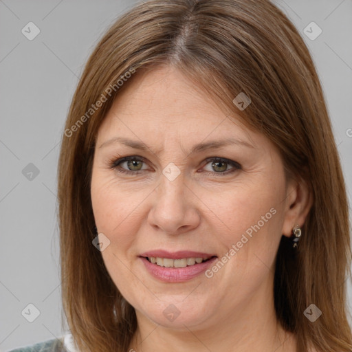 Joyful white adult female with medium  brown hair and brown eyes