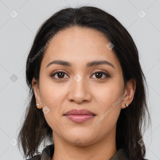 Joyful latino young-adult female with medium  brown hair and brown eyes