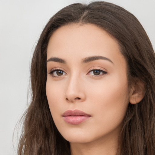 Neutral white young-adult female with long  brown hair and brown eyes