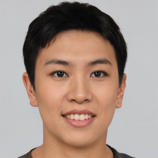 Joyful asian young-adult female with short  black hair and brown eyes