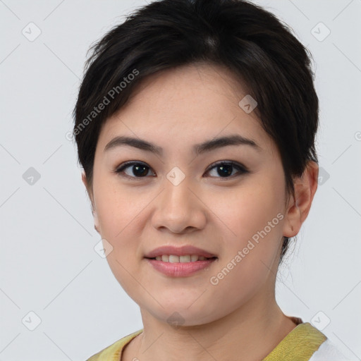 Joyful asian young-adult female with short  brown hair and brown eyes