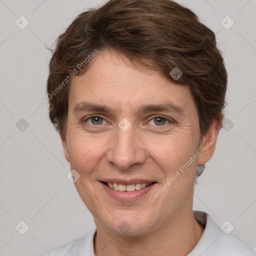 Joyful white adult male with short  brown hair and grey eyes