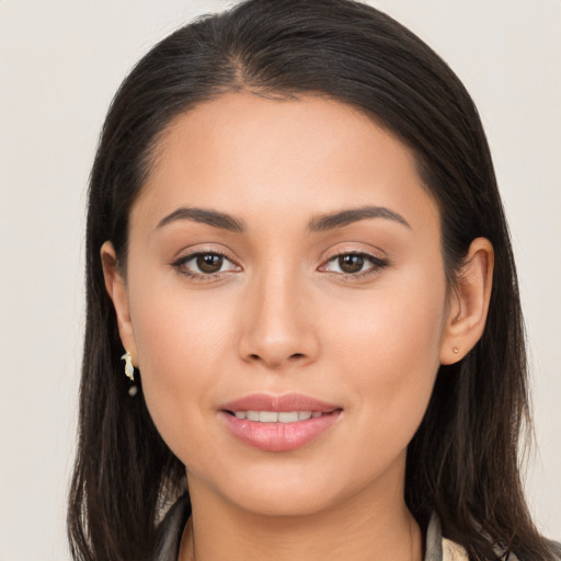 Joyful white young-adult female with long  brown hair and brown eyes