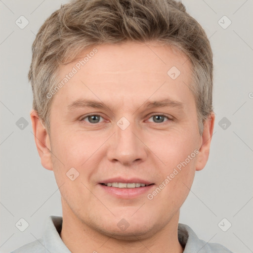 Joyful white adult male with short  brown hair and grey eyes