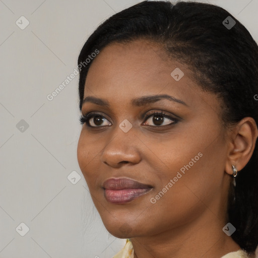 Joyful black young-adult female with medium  black hair and brown eyes