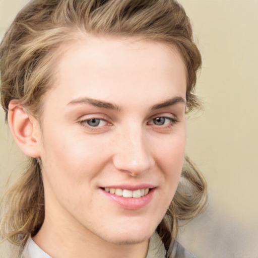 Joyful white young-adult female with medium  brown hair and blue eyes