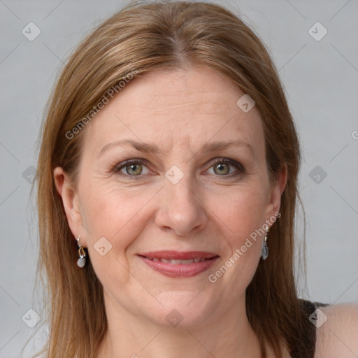 Joyful white adult female with medium  brown hair and grey eyes