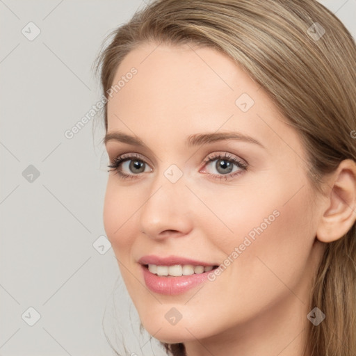 Joyful white young-adult female with long  brown hair and blue eyes