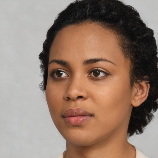 Neutral latino young-adult female with short  black hair and brown eyes