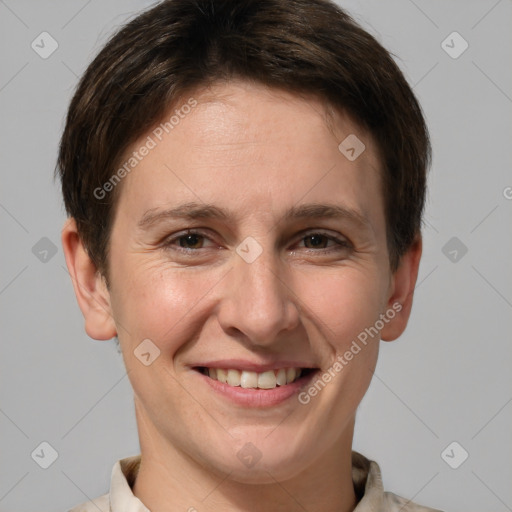 Joyful white adult female with short  brown hair and grey eyes