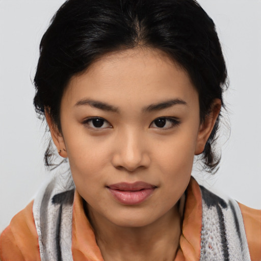 Joyful asian young-adult female with medium  black hair and brown eyes