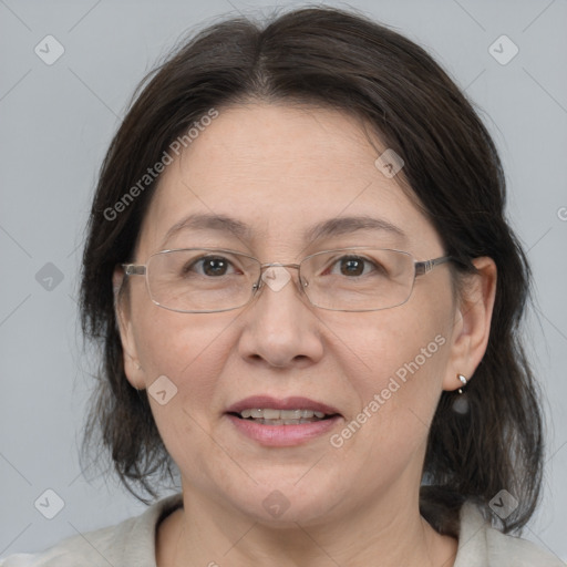 Joyful white adult female with medium  brown hair and grey eyes