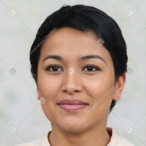 Joyful latino young-adult female with short  brown hair and brown eyes