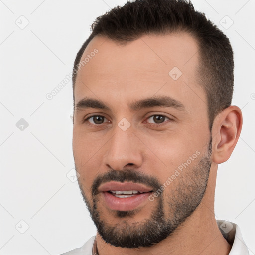 Joyful white young-adult male with short  brown hair and brown eyes