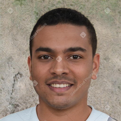 Joyful white young-adult male with short  black hair and brown eyes