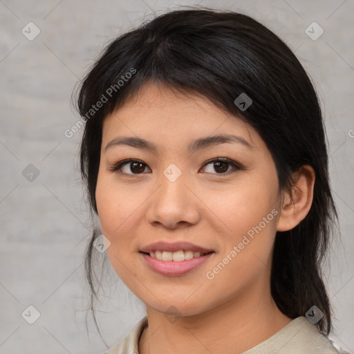 Joyful asian young-adult female with medium  brown hair and brown eyes