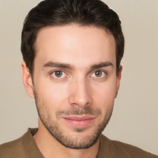 Joyful white young-adult male with short  brown hair and brown eyes