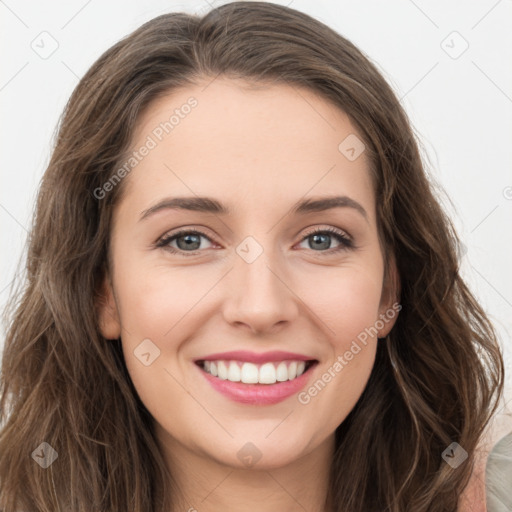 Joyful white young-adult female with long  brown hair and green eyes