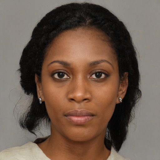 Neutral black young-adult female with medium  black hair and brown eyes