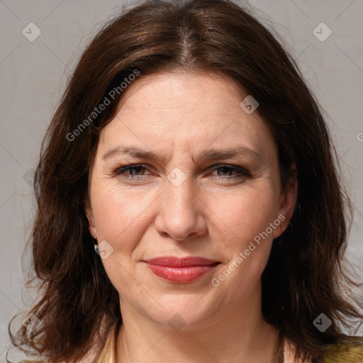 Joyful white adult female with medium  brown hair and brown eyes