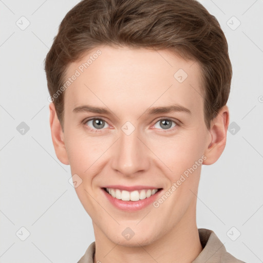 Joyful white young-adult female with short  brown hair and grey eyes