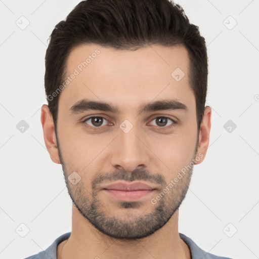 Joyful white young-adult male with short  black hair and brown eyes